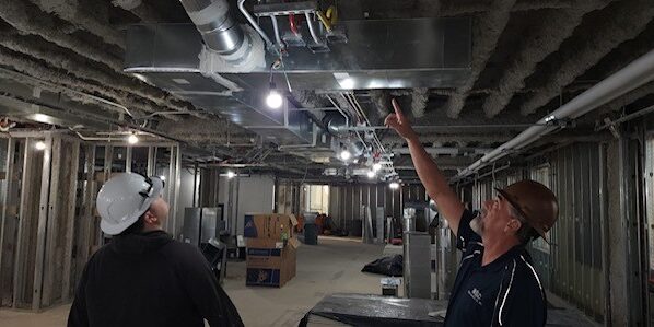 Workers looking at new construction work